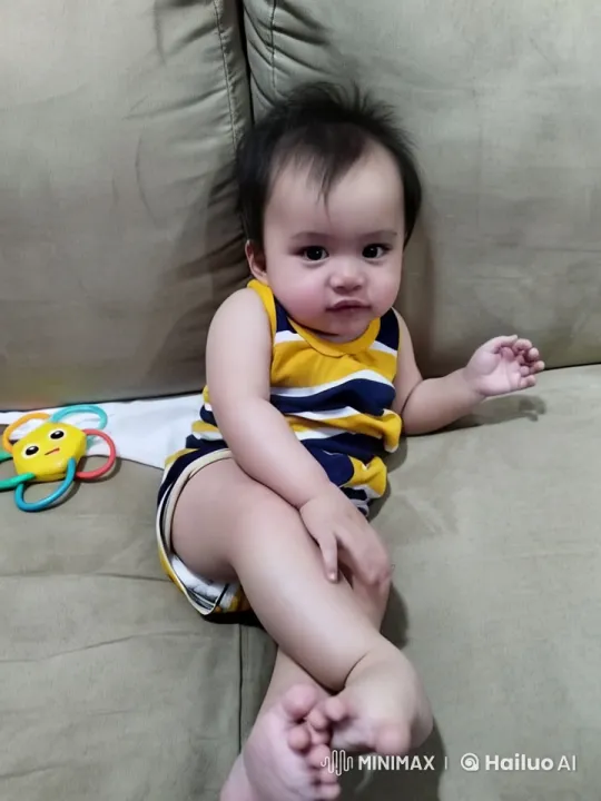 Toddler Dancing and Boxing Playfully on Sofa – AI Generated Video | Hailuo AI