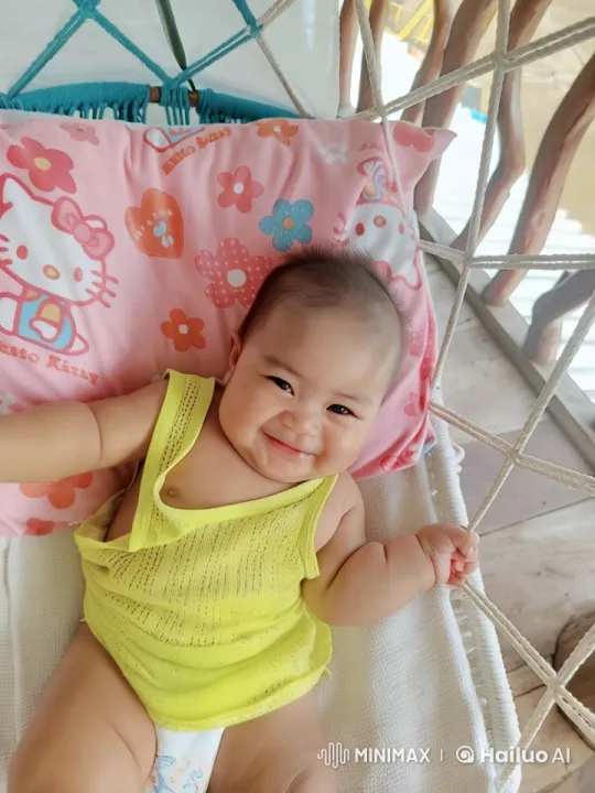 Baby Dancing Joyfully on Pink Pillow with Soft Lighting – AI Generated Video | Hailuo AI