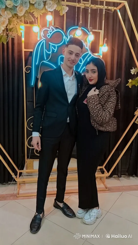 Couple Embracing in Festive Neon Decor – AI Generated Video | Hailuo AI