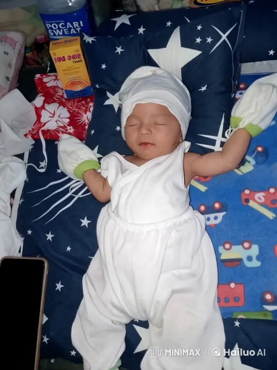 Baby's Peaceful Moment on Starry Blue Blanket – AI Generated Video | Hailuo AI