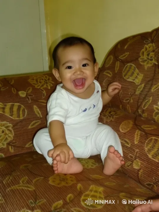 Baby's Playful Dance and Boxing Moves on Sofa – AI Generated Video | Hailuo AI
