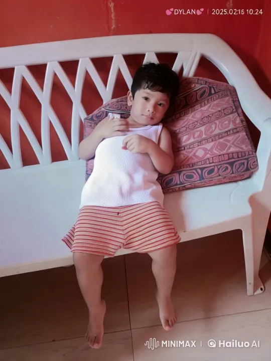 Cozy Indoor Scene: Child Relaxing on Bench – AI Generated Video | Hailuo AI
