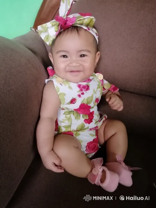 Baby Girl's Playful Kung Fu Dance on Brown Couch – AI Generated Video | Hailuo AI