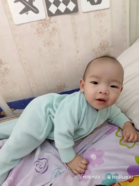 Baby Dancing in Onesie on Flowered Bed – AI Generated Video | Hailuo AI