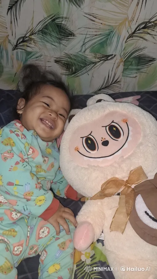 Senyumin Saja is a Malay phrase which translates to Just Smile in English. It's not a title of a specific content, but rather a phrase that might be used in various contexts to encourage someone to smile or to suggest that smiling can be a simple solution. – AI Generated Video | Hailuo AI