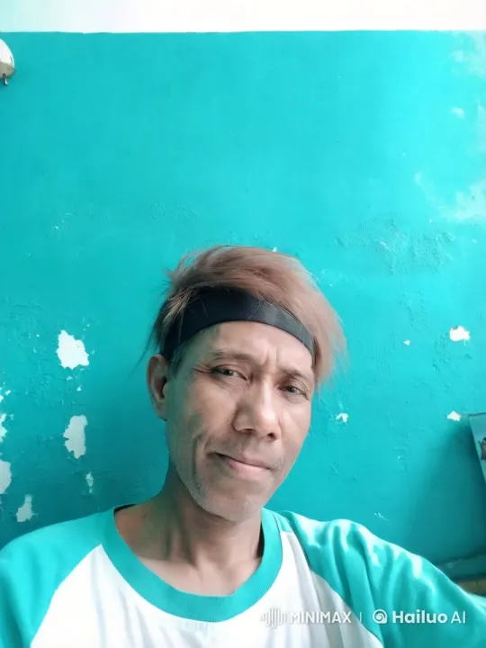 Warm Embrace Between Friends Against a Teal Wall – AI Generated Video | Hailuo AI