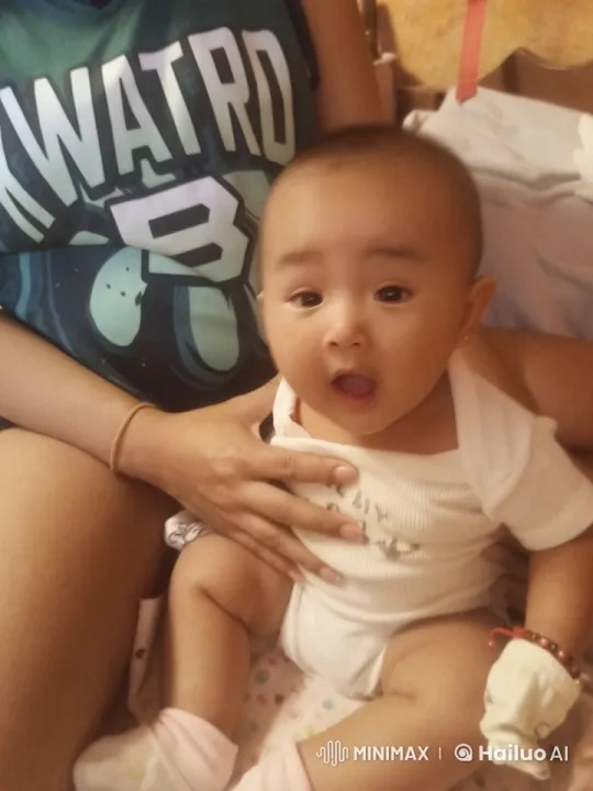 Baby and Adult Joyfully Interact on Bed – AI Generated Video | Hailuo AI