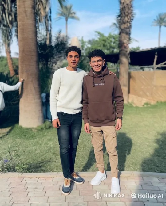 Two Young Men Engage in Playful Fight in Garden Setting – AI Generated Video | Hailuo AI