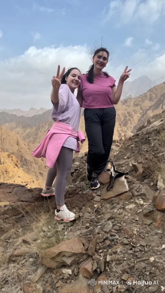 Playful Fight Between Two Women in Mountainous Setting – AI Generated Video | Hailuo AI