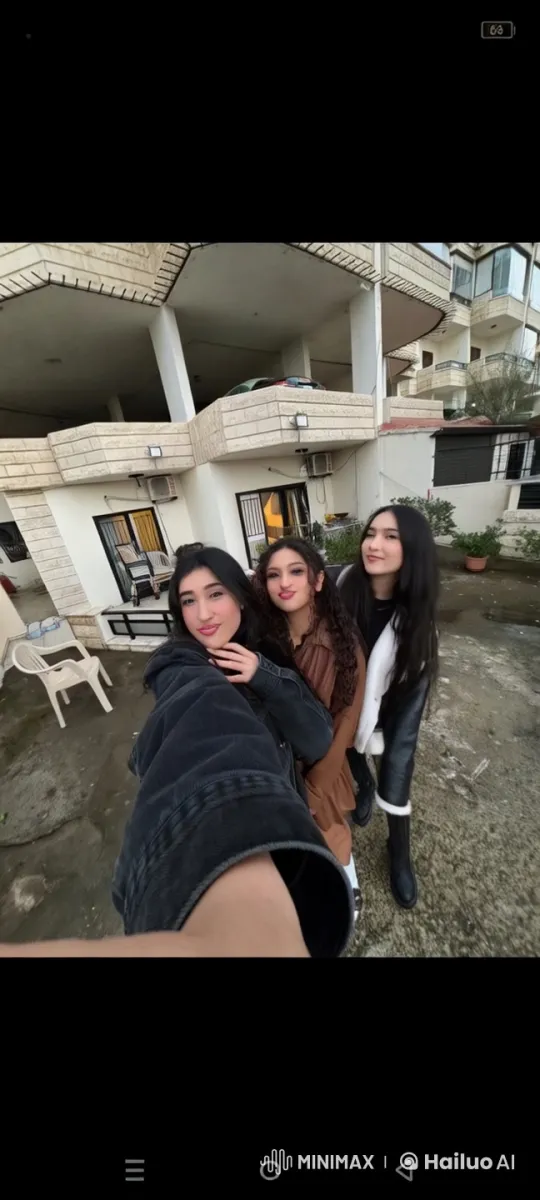 Three Friends Taking a Selfie Outside a Residential Building – AI Generated Video | Hailuo AI