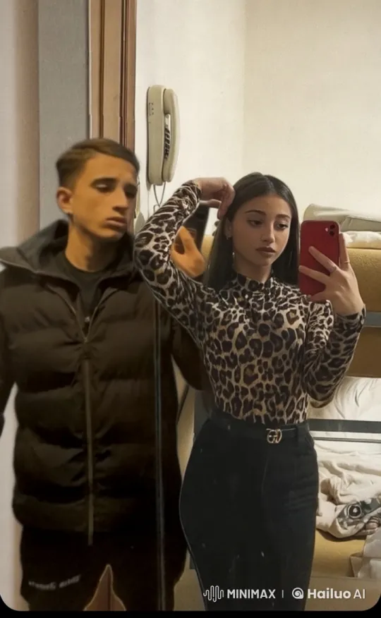 Boy Kisses Girl Taking Selfie in Cozy Bedroom – AI Generated Video | Hailuo AI