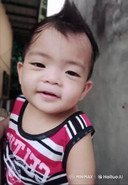 Child in Striped Tank Top in Lively Outdoor Setting – AI Generated Video | Hailuo AI