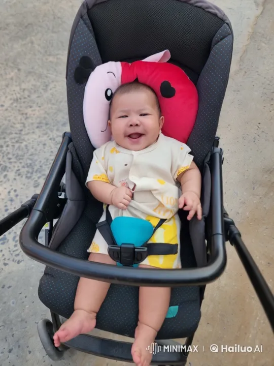Baby Dancing Playfully in Stroller with Ladybug Pillow – AI Generated Video | Hailuo AI