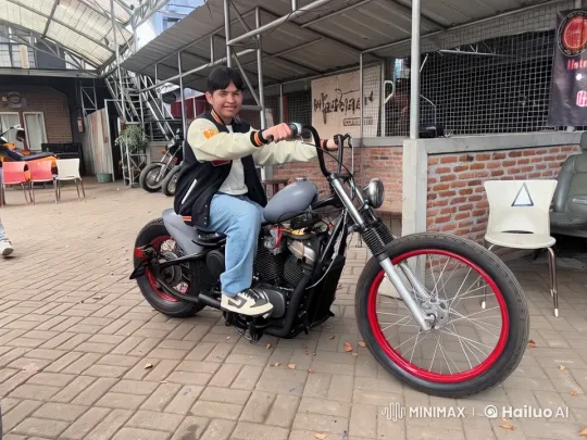 Young Racer Prepares on Custom Motorcycle in Vintage Garage – AI Generated Video | Hailuo AI