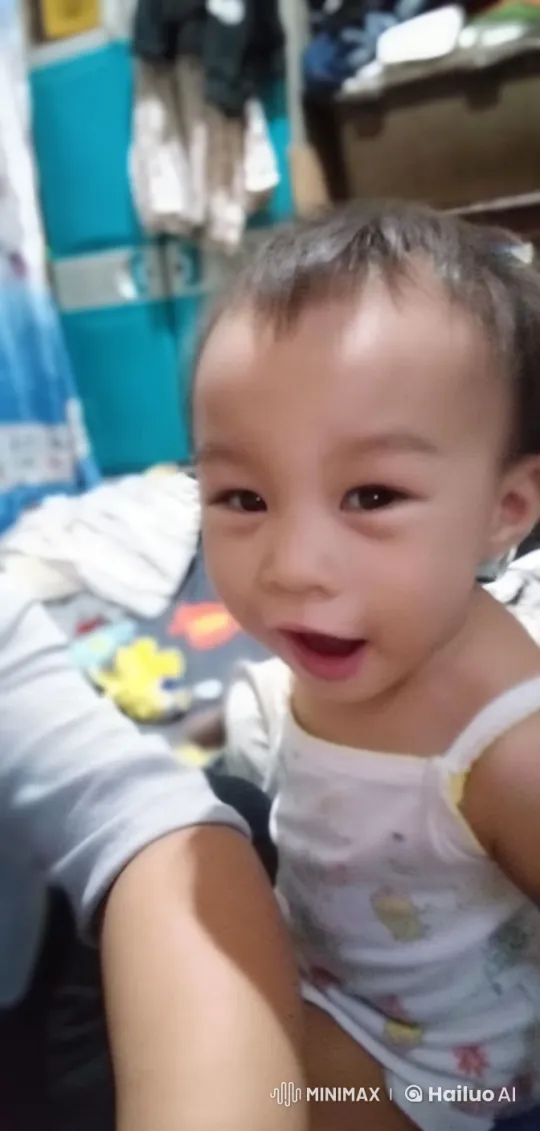 Toddler Joyfully Practices Kungfu Moves in Cluttered Room – AI Generated Video | Hailuo AI
