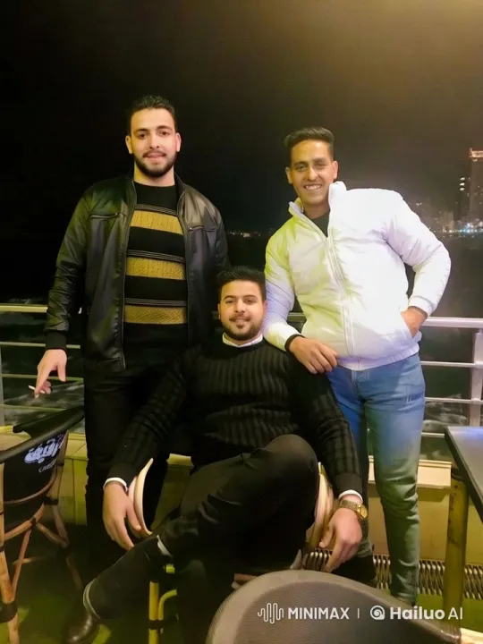 Night Balcony: Men's Stylish Pose Against City Lights – AI Generated Video | Hailuo AI