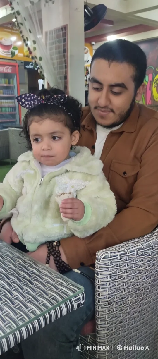 Nun and Child Enjoying Ice Cream in Cozy Café – AI Generated Video | Hailuo AI