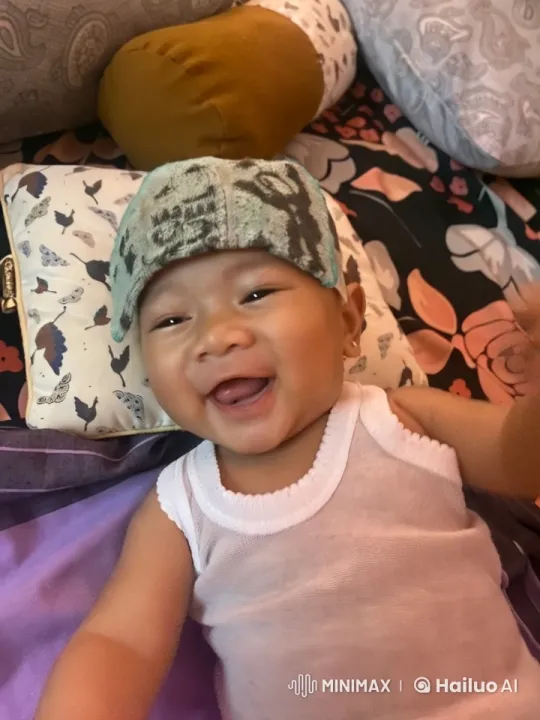Baby Dancing Joyfully on Colorful Bedding – AI Generated Video | Hailuo AI