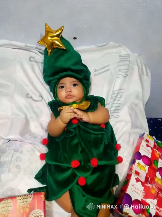 Baby in Christmas Tree Costume Dances Festively – AI Generated Video | Hailuo AI