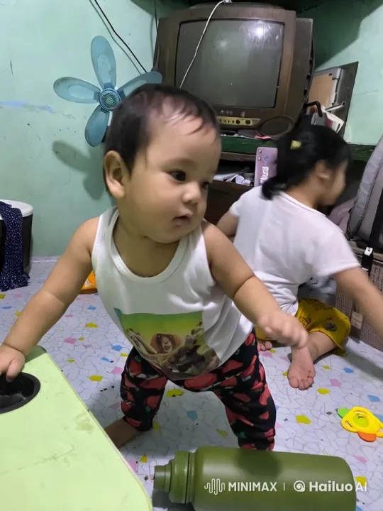Energetic Child Dancing in Colorful, Cluttered Room – AI Generated Video | Hailuo AI