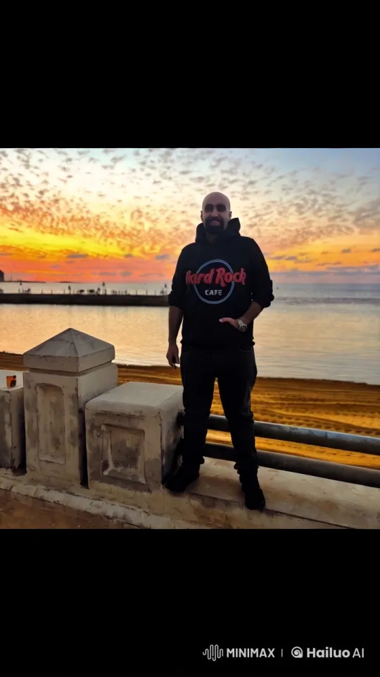 Sunset Serenity: Person on Seaside Concrete – AI Generated Video | Hailuo AI