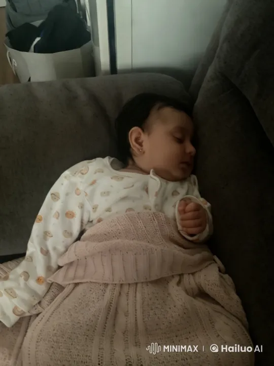 Baby Dancing Joyfully on Grey Sofa – AI Generated Video | Hailuo AI