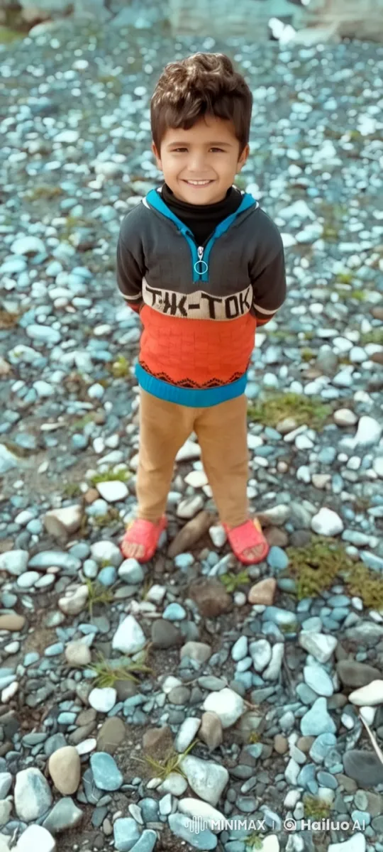 Child in Vibrant Clothing Amidst Rocky Terrain – AI Generated Video | Hailuo AI