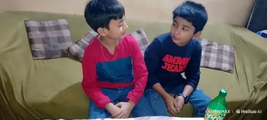 Boys Share Intimate Kiss on Green Couch – AI Generated Video | Hailuo AI