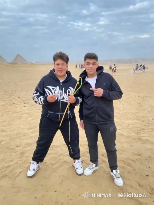 Mock Combat Scene with Sticks in Desert Near Pyramids – AI Generated Video | Hailuo AI