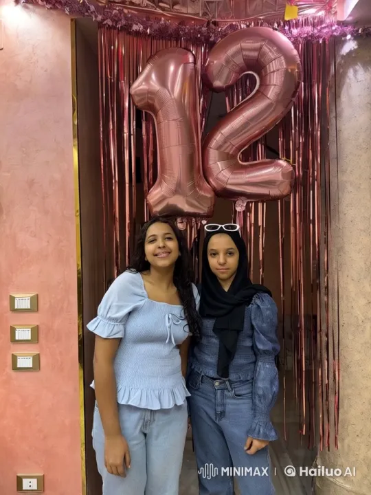 Girls Celebrate with Pink Balloons in Festive Setting – AI Generated Video | Hailuo AI