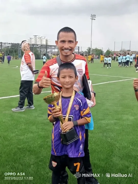 Boy Celebrates Soccer Victory with Trophy – AI Generated Video | Hailuo AI