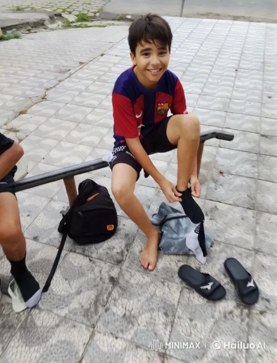 Boy Prepares for Football in Simple, Aesthetic Scene – AI Generated Video | Hailuo AI