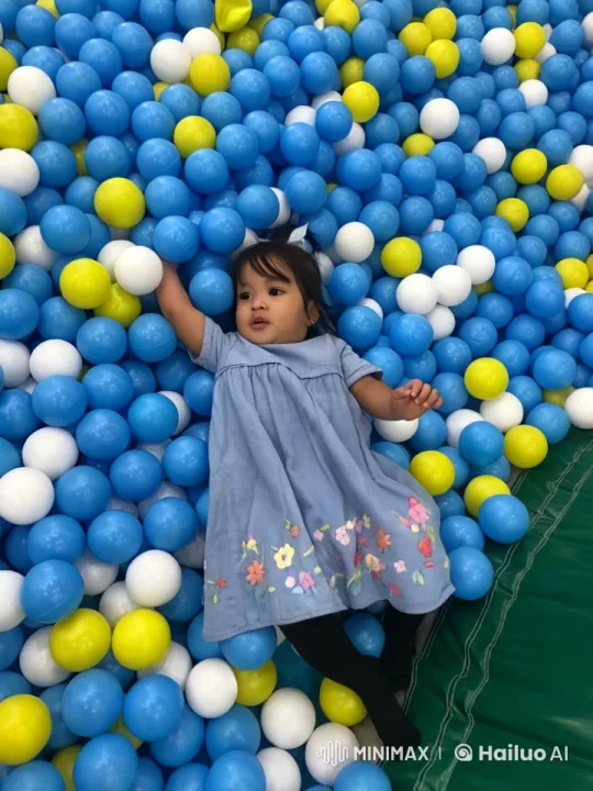 Child Dancing Joyfully in Colorful Ball Pit – AI Generated Video | Hailuo AI