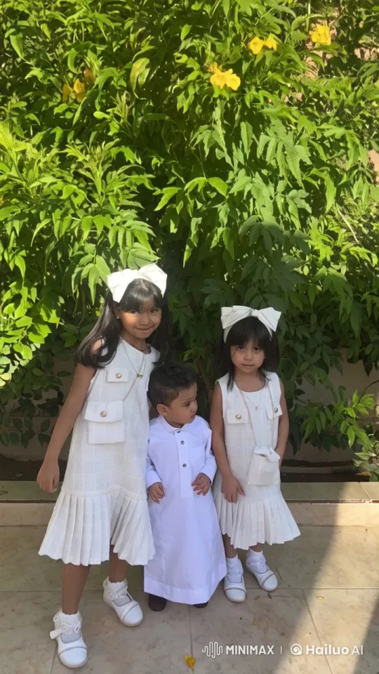 Children in White Outfits in Serene Garden Setting – AI Generated Video | Hailuo AI