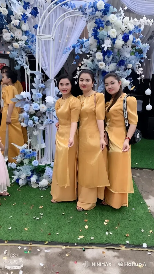 Elegant Women in Golden Gowns at Floral Arch – AI Generated Video | Hailuo AI