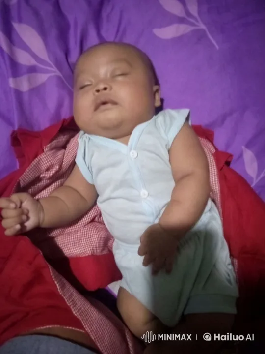 Baby Dancing and Playing on Colorful Bedspread – AI Generated Video | Hailuo AI