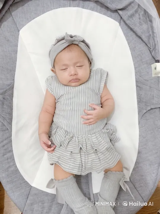 Baby Dancing in Striped Outfit on Soft Cushion – AI Generated Video | Hailuo AI
