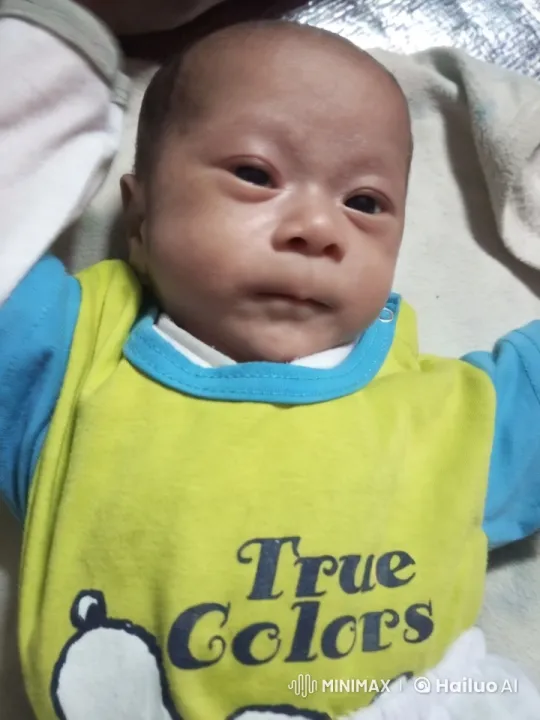 Calm Baby in Soft Environment with 'True Colors' Onesie – AI Generated Video | Hailuo AI