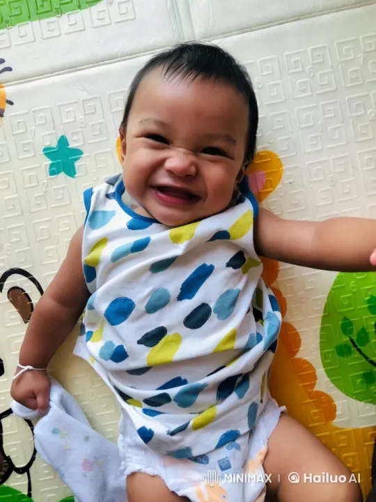 Baby Dancing Playfully on Colorful Mat – AI Generated Video | Hailuo AI