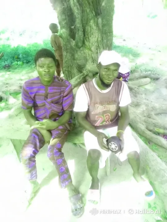 Two Men Relax on a Bench in a Lush Setting – AI Generated Video | Hailuo AI