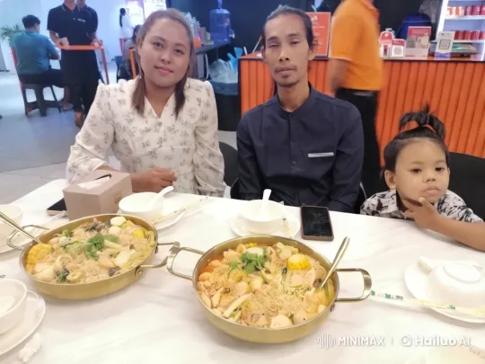 Family Enjoying Hotpot and Unexpected Kungfu Display – AI Generated Video | Hailuo AI