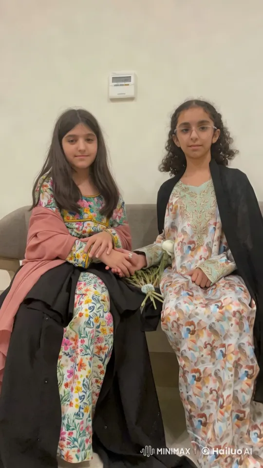 Two Girls Embrace in Traditional Attire with Flowers – AI Generated Video | Hailuo AI