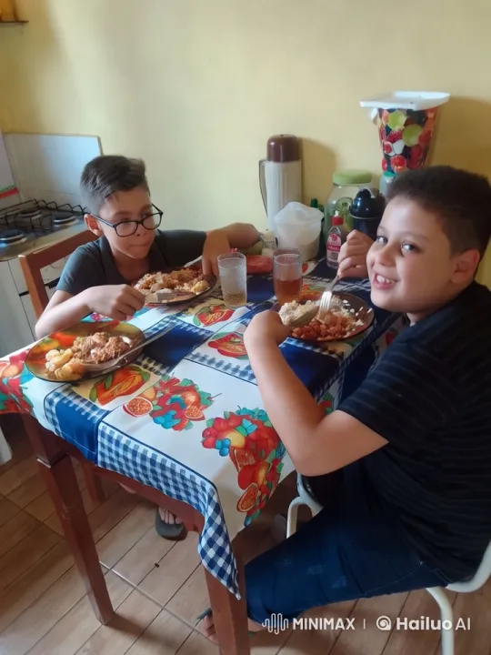 Boys Enjoying Meal at Vibrant Kitchen Table – AI Generated Video | Hailuo AI