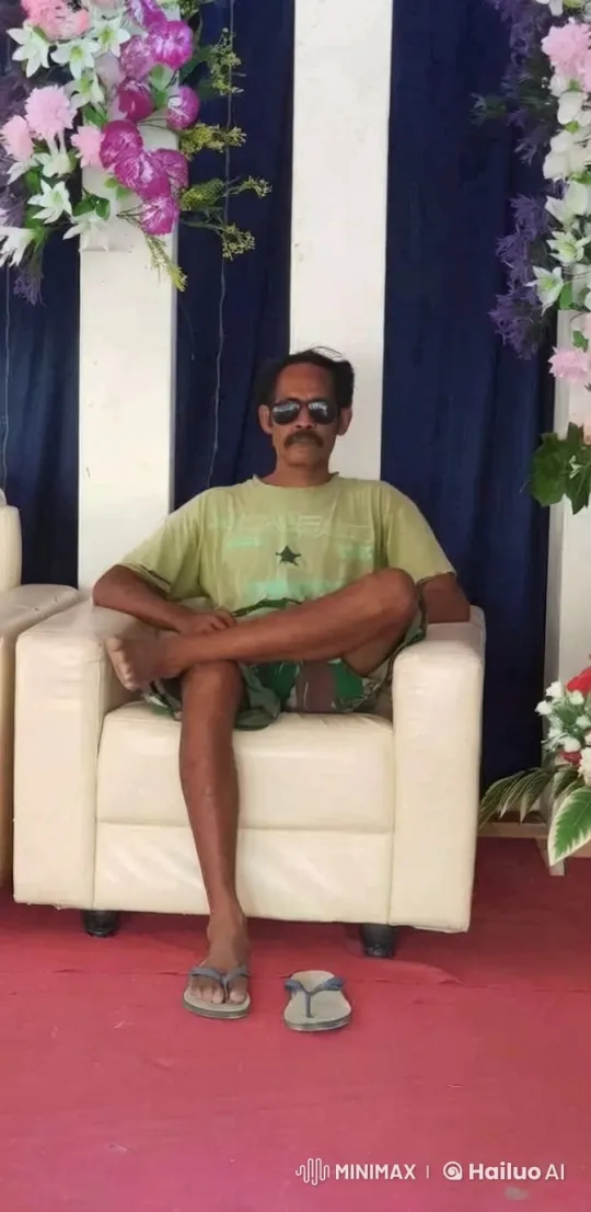 Person in Green Approaches Camera in Florally Decorated Room – AI Generated Video | Hailuo AI