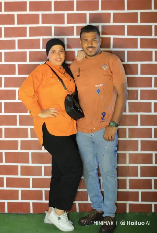 Couple Poses in Harmonious Colors Against Brick Wall – AI Generated Video | Hailuo AI