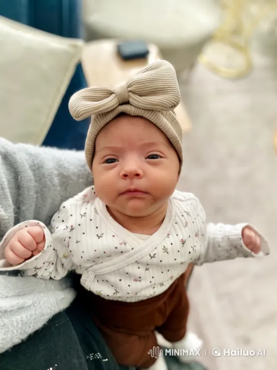 Close-up of Serene Baby in Cozy Setting – AI Generated Video | Hailuo AI