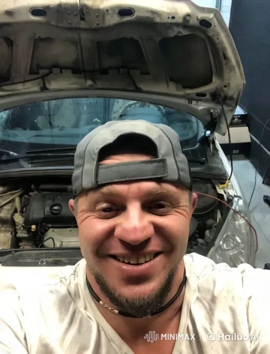 Mechanic Working on Car Engine in Brightly Lit Garage – AI Generated Video | Hailuo AI