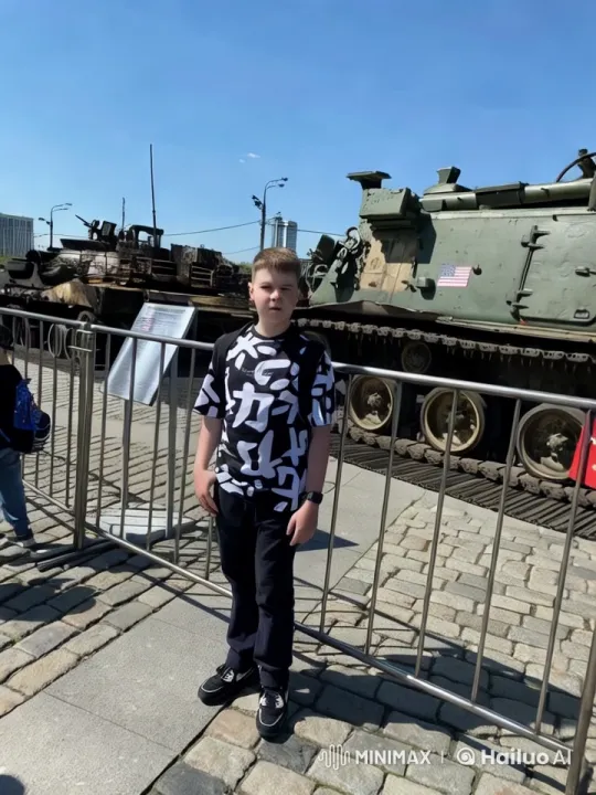 Boy Stands Before Military Tanks in Aesthetic Scene – AI Generated Video | Hailuo AI