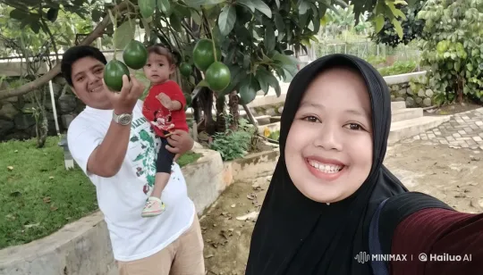 Family Enjoying Serene Garden Amidst Fruit-Laden Tree – AI Generated Video | Hailuo AI