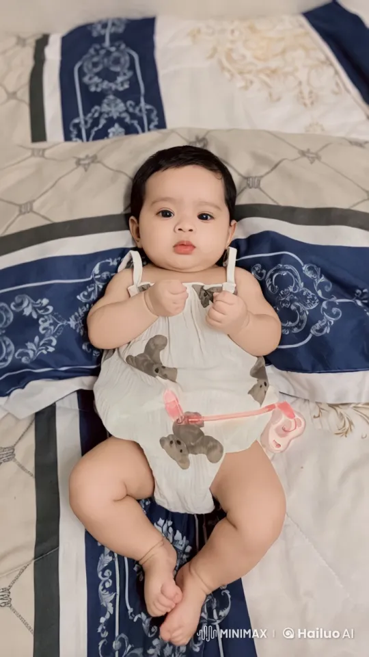 Baby's Playful Kungfu Dance on Patterned Bed – AI Generated Video | Hailuo AI
